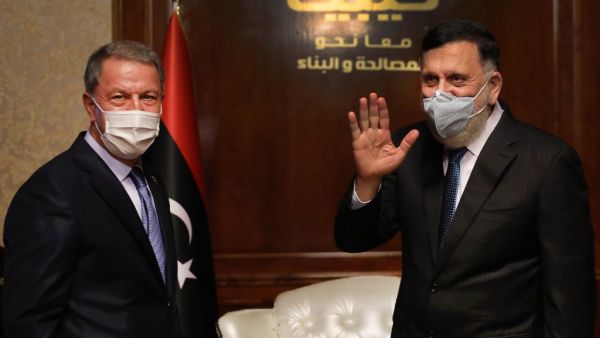 Fayez al-Sarraj (R), Prime Minister of Libya's UN-recognised Government of National Accord (GNA) receives Turkish Defense Minister Hulusi Akar, in the Libyan capital Tripoli on July 3, 2020.  AFP