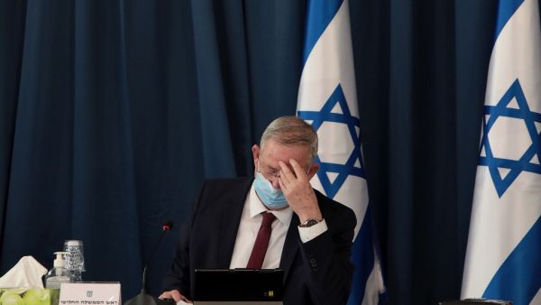 Israeli defence minister and alternate prime minister Benny Gantz wears a protective mask as he attends the weekly cabinet meeting at the foreign ministry in Jerusalem on July 5, 2020. GALI TIBBON / POOL / AFP