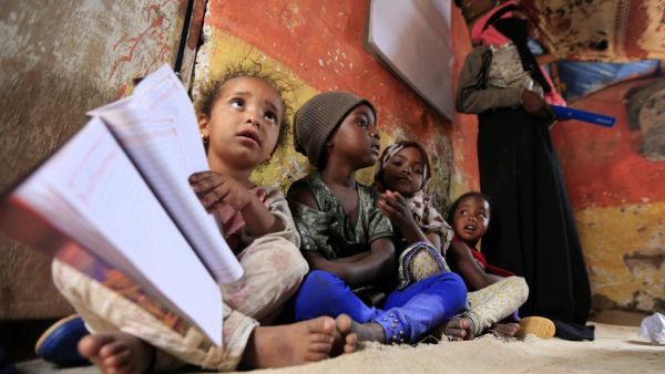 Children of Yemen's minority group known as "Muhamasheen" -- literally the "Marginalised" attend a lesson at a slum in the capital Sanaa on July 4, 2020. At a time when the Black Lives Matter movement is reshaping societies, black Yemenis have scant hope for an end to centuries of discrimination that has only worsened during the civil war. In Sanaa, members of the minority group known as "Muhamasheen" live in dismal conditions in densely populated slums. They count among the poorest of the poor in the Arab 