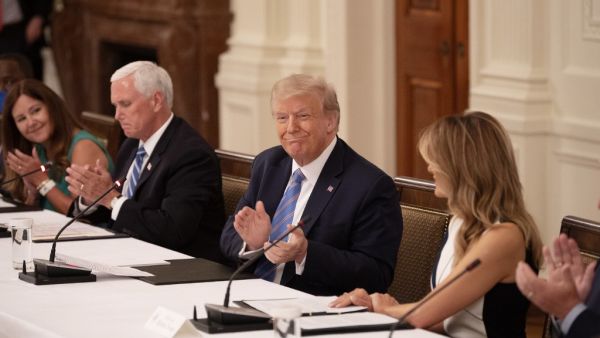 (L-R) Karen Pence, US Vice President Mike Pence, President Donald Trump and First Lady Melania Trump attend a roundtable discussion on the Safe Reopening of America’s Schools during the coronavirus pandemic, in the East Room of the White House on July 7, 2020, in Washington, DC. JIM WATSON / AFP