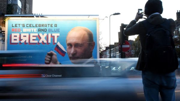 In this file photo taken on November 08, 2018 A Brexit-themed billboard depicting Russian President Vladimir Putin that reads "Lets celebrate a red, white and blue Brexit" is seen in north London on November 8, 2018. Britain on Thursday accused "Russian actors" of seeking to disrupt last year's general election by circulating leaked trade documents between London and Washington. Parliament's Intelligence and Security Committee (ISC) had launched a probe into suspicions of Russian interference in the 2016 Br