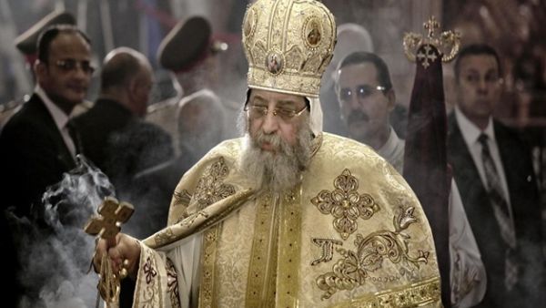 Coptic Pope Tawadros II leads prayers during the Easter Eve service at St. Mark's Cathedral in Cairo - AFP