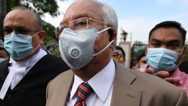 Malaysia's former prime minister Najib Razak (C) arrives at the Duta Court complex awaiting a verdict in his corruption trial in Kuala Lumpur, Malaysia on July 28, 2020.  MOHD RASFAN/AFP/GETTY IMAGES