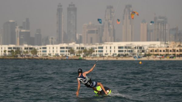 An athlete kite-surfs during the Dubai watersport festival, organized by the DIMC, on June 26, 2020. KARIM SAHIB/AFP