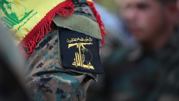 Hezbollah Funeral,where village citizens and Hezbollah soldiers carry the coffin of "Mohammad Wehbi" the Hezbollah fighter who was killed in Syria war. (Shutterstock/ File Photo)