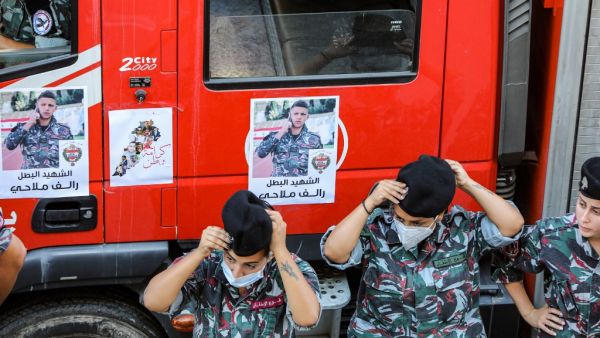 Firefighters attend a funerary ceremony for their comrade Ralph Malahi, who was killed in the monster explosion at the port of Beirut and whose remains were recently found and identified, at the civil defence headquarters in the Karantina (La Quarantaine or Quarantina) neighbourhood of the capital just by the ravaged port, on August 15, 2020. ANWAR AMRO / AFP