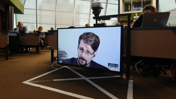 In this file photo former US National Security Agency (NSA) contractor and whistle blower Edward Snowden speaks via video link from Russia as he takes part in a round table meeting on the subject of "Improving the protection of whistleblowers" on March 15, 2019, at the Council of Europe in Strasbourg, eastern France. President Donald Trump said August 15 he will "take a look" at pardoning Edward Snowden, the former US intelligence contractor who revealed in 2013 that the US government was spying on its citi