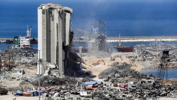 Diggers remove earth at the blast site next to the silos at the port of Beirut on August 16, 2020, in the aftermath of the massive explosion there that ravaged Lebanon's capital. ANWAR AMRO / AFP