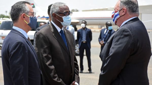 US Secretary of State Mike Pompeo (R) is welcomed by a Sudanese official in Khartoum on August 25, 2020. Pompeo is on an official visit to Sudan to urge more Arab countries to normalise ties with Israel, following the US-brokered Israel-UAE agreement. He is the first American top diplomat to visit Sudan since Condoleezza Rice went in 2005.  AFP