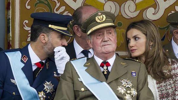 King Felipe pictured with former king Juan Carlos and Spain's Queen Letizia at the Spanish National day military parade in Madrid on October 12, 2012. (AFP)