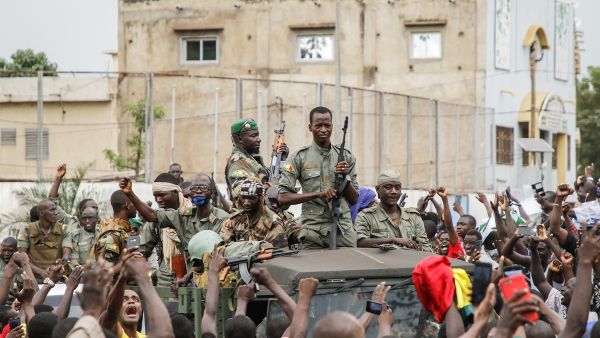 Armed members of the FAMA (Malian Armed Forces) are celebrated by the population as they parade at Independence Square in Bamako, Mali on Wednesday. Photo: AFP