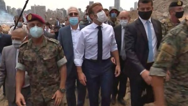 A video grab shows French President Emmanuel Macron inspecting the damages at the port of Lebanon’s capital Beirut, August 6, 2020.  (AFP)