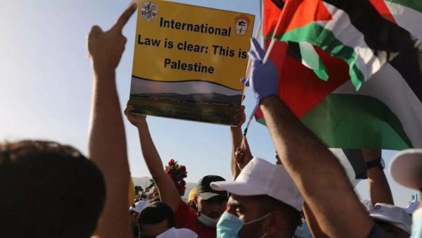Palestinians participate in a big rally to protest against Israel's plan to annex parts of the occupied West Bank, in Jericho on June 22, 2020. (AFP)