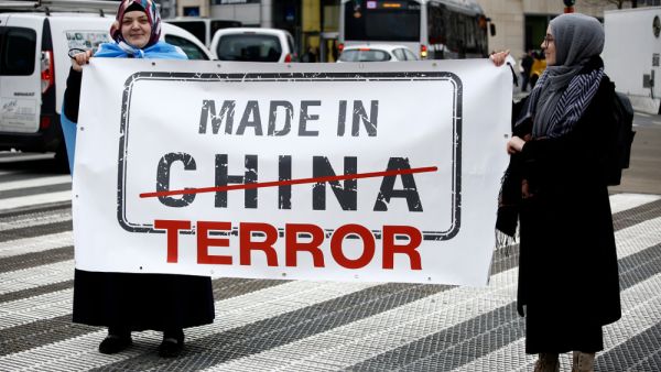 Activists protest the treatment of Uyghur Muslims by Chinese authorities in Xinjiang province at a protest outside the headquarters of the European Union. (Shutterstock/ File Photo)