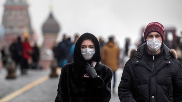 Russian people wears a medical mask walking on Red Square in Moscow. (Shutterstock/ File Photo)