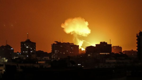 Smoke and flames rise after war planes belonging to the Israeli army carried out airstrikes over Gaza City on August 18, 2020. A rocket was fired on late August 18 from Gaza towards Israel, the army said, hours after the Jewish state warned Hamas it was risking "war" by failing to stop incendiary balloon attacks. The tensions come amid fuel shortages in the Palestinian enclave caused by an Israeli blockade, which has triggered widespread blackouts.  MAHMUD HAMS / AFP