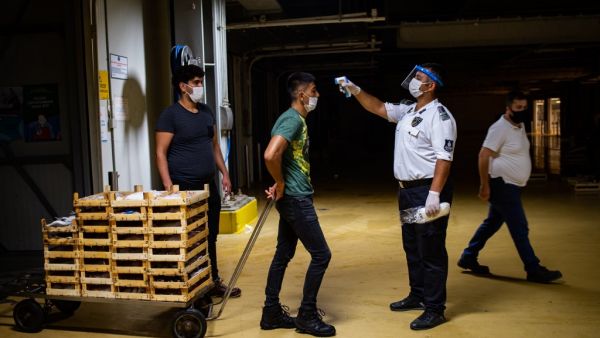 In the fish market, one of the main places to buy fish in Istanbul, masks, social distancing and continuous hand hygiene are mandatory to prevent the spread of the Covid-19 (novel coronavirus). Yasin AKGUL / AFP