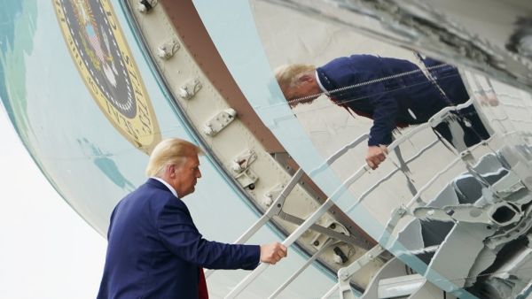 US President Donald Trump boards Air Force One at Wilmington International Airport in Wilmington, North Carolina, on September 2, 2020. Trump was in Wilmington to designate it as the first American World War II heritage city on the 75th anniversary of the end of WWII. MANDEL NGAN / AFP