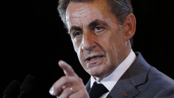 In this file photo taken on September 26, 2016 Former French president and candidate for the right-wing Les Republicains (LR) party primary ahead of the 2017 presidential election, Nicolas Sarkozy gestures as he speaks during a campaign meeting in Dozule. Nicolas Sarkozy, who must be tried at the end of 2020 in the so-called "tapping" case, will appear from March 17 to April 15, 2021 in a second trial on his campaign costs for the 2012 presidential election, the prosecution confirmed on September 3, 2020. C