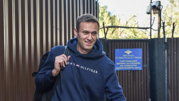 This file photo taken on August 23, 2019 shows Russian opposition leader Alexei Navalny leaving the detention centre in Moscow after serving 30 days in jail. Russian opposition leader Alexei Navalny's condition is improving and he is able to get out of bed for brief periods, the German hospital treating him said Monday, September 14, 2020. "The patient has been successfully removed from mechanical ventilation," Berlin's Charite hospital said in a statement. "He is currently undergoing mobilisation and is ab