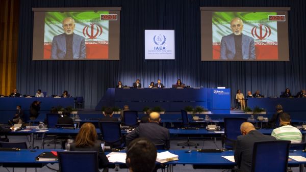 Mohammad Javad Zarif, Iranian foreign minister, is seen speaking on a screen as he attends virtually the 64th General Conference of the International Atomic Energy Agency (IAEA) at its headquarters in Vienna, Austria on September 21, 2020. JOE KLAMAR / AFP