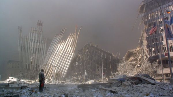 A man stands among the rubble after the collapse of the first World Trade Centre Tower in New York City on September 11, 2001. Photo: AFP