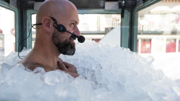Austrian sportsman Josef Koeberl stands still in an ice-filled glass cabin as he tries to set a World Record of staying in ice. (Twitter)