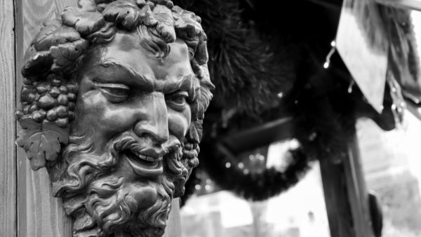 Bacchus (Dionysus) mask attached to the mulled wine stall at Christmas market in Paris (France). (Shutterstock/ File Photo)