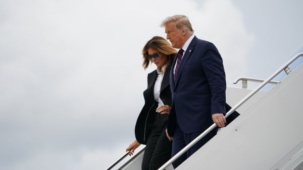 US President Donald Trump and First Lady Melania Trump step off Air Force One upon arrival at Cleveland Hopkins International Airport in Cleveland, Ohio on September 29, 2020. President Trump is in Cleveland, Ohio for the first of three presidential debates. MANDEL NGAN / AFP