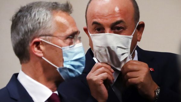 NATO Secretary-General Jens Stoltenberg (L) and Turkey's Foreign Minister Mevlut Cavusoglu (R) arrive for a press conference after their meeting at the Foreign Ministry building in Ankara, on October 05, 2020.  Adem ALTAN / AFP