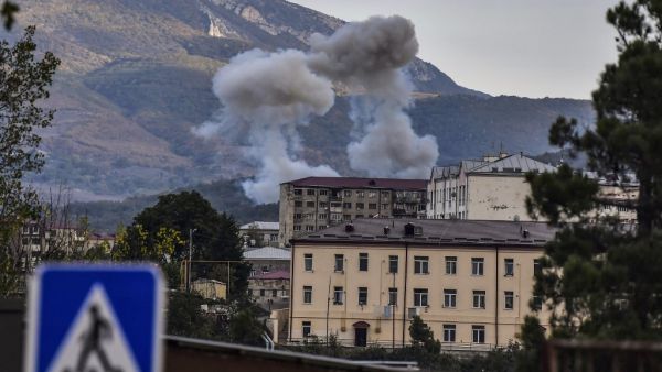 Smoke rises after shelling in Stepanakert on October 9, 2020, during ongoing fighting between Armenia and Azerbaijan over the disputed region of Nagorno-Karabakh. ARIS MESSINIS / AFP
