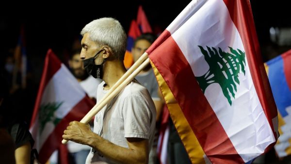 Lebanese of Armenian origin raise Armenian, national and Nagorno-Karabakh flags as they take part in a rally organised by the Tashnak party, in support of the Armenians of Nagorno-Karabakh, in the capital Beirut's eastern suburban neighbourhood of Bourj Hamoud, on October 9, 2020. Armenia and Azerbaijan have for decades been locked in a conflict over Nagorno-Karabakh, an ethnically Armenian area which broke away from Baku in a 1990s war that cost about 30,000 lives. Heavy fighting erupted on September 27 in