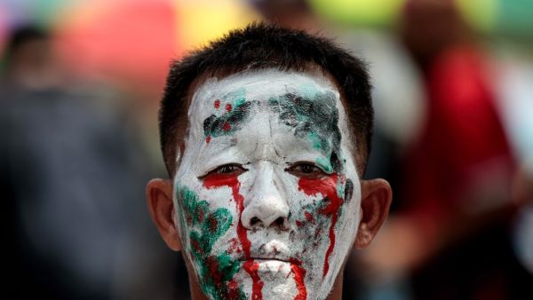 A pro-democracy protester takes part in an anti-government rally in Bangkok on October 14, 2020. Jack TAYLOR / AFP