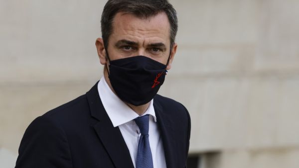 In this file photo taken on October 7, 2020 French Health Minister Olivier Veran leaves the Elysee presidential Palace in Paris after attending the weekly cabinet meeting. French police searched the home of Health Minister Olivier Veran on October 15, 2020 as part of an inquiry into the government's handling of the coronavirus crisis, his office said. Veran is one of several current or former ministers being probed over their response to the pandemic following complaints by victims of Covid-19 that they wer
