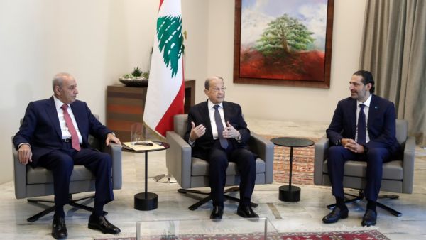 Lebanon's Parliament Speaker Nabih Berri (L) President Michel Aoun (C) and former prime minister Saad Hariri meet at the presidential palace in Baabda, east of the capital Beirut, after Aoun named Hariri to form a new cabinet, on October 22, 2020. ANWAR AMRO / POOL / AFP
