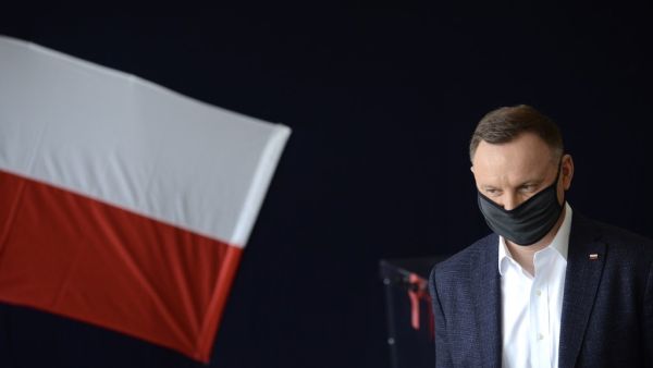 In this file photo taken on June 28, 2020, Polish President Andrzej Duda arrives at a polling station to take part in a voting during Poland's Presidental election in Krakow, Poland. Poland's President Andrzej Duda has tested positive for coronavirus, an aide said on October 24, 2020, as the country faces a record rise in cases.  BARTOSZ SIEDLIK / AFP