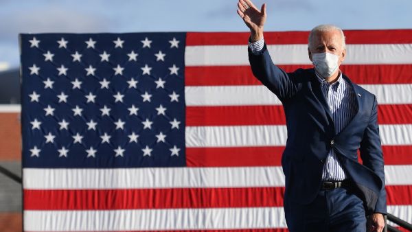 Democratic presidential nominee and former Vice President Joe Biden waves to supporters before speaking at a Drive-In rally at Dallas High School, in Dallas, Pennsylvania, on October 24, 2020. Angela Weiss / AFP