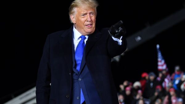 US President Donald Trump points as he leaves a campaign rally at Waukesha County Airport in Waukesha, Wisconsin on October 24, 2020. MANDEL NGAN / AFP