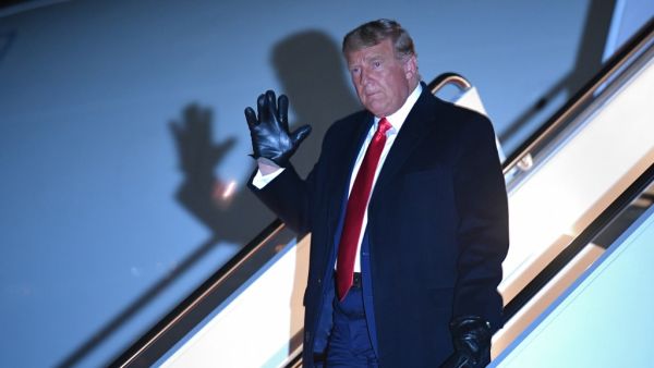 US President Donald Trump waves as he steps off Air Force One upon arrival at Andrews Air Force Base in Maryland on October 30, 2020. The President returns after a campaign rally at Rochester International Airport in Rochester, Minnesota. MANDEL NGAN / AFP