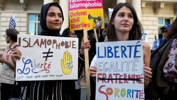 Women join a demonstration organised by "Stand up to Racism" outside the French Embassy in London on 26 August, 2016 against the Burkini ban on French beaches (AFP)