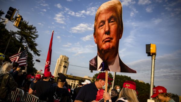 Supporters of President Donald Trump gather outside of Walter Reed National Military Medical Center after the President was admitted for treatment of COVID-19 on October 4, 2020 in Bethesda, Maryland. The President announced via Twitter early Friday morning that he had tested positive. Numerous other prominent GOP figures and members of Congress have also tested positive in the last few days. Samuel Corum/Getty Images/AFP Samuel Corum / GETTY IMAGES NORTH AMERICA / Getty Images via AFP