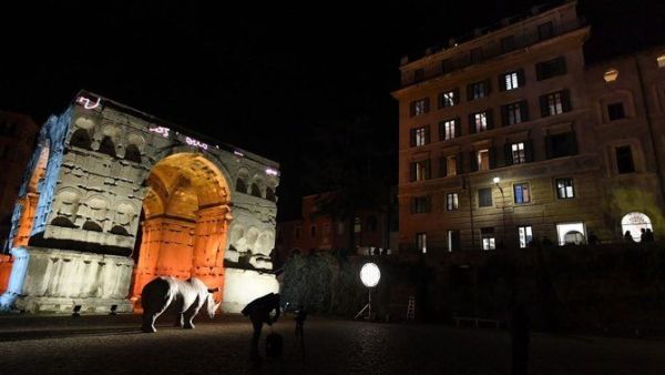 The 4th Century Arch of Janus (L) and the Palazzo Rhinoceros (R), the new building of the Alda Fendi-Esperimenti Foundation dedicated to arts, are pictured. (File/AFP)