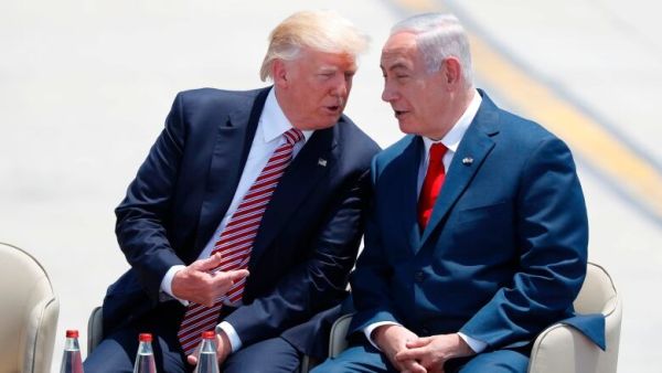 Israeli Prime Minister Benjamin Netanyahu and Trump speak after the U.S. president's arrival at Ben Gurion International Airport in Tel Aviv on Monday. (Jack Guez/AFP/Getty Images)