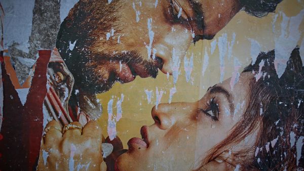 Bollywood movie poster stuck in the street (Shutterstock)