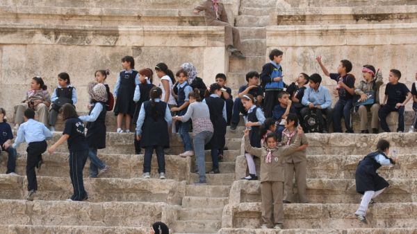 Jordan students visiting the antique Amphitheater in Amman, Jordan  (Shutterstock)	
