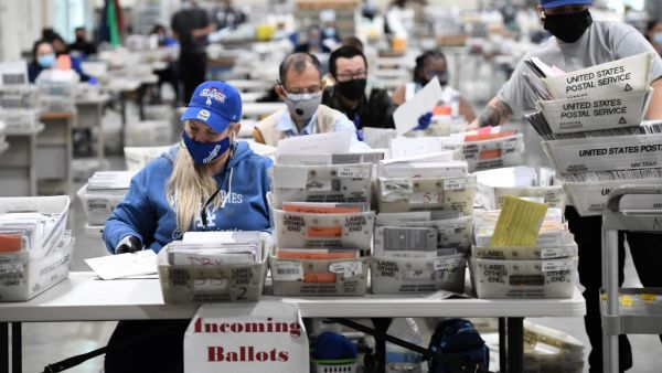 Mail-in ballots for the US presidential election are sorted at the Los Angeles County Registrar Recorders' mail-in ballot processing center at the Pomona Fairplex in Pomona, California, October 28, 2020. Robyn Beck / AFP