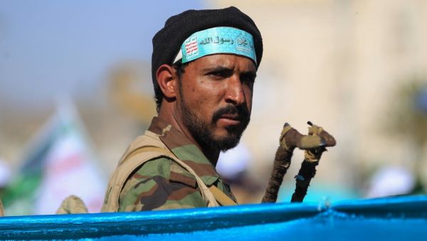 A fighter loyal to Yemen's Huthi rebels stands guard during a ceremony marking the birth anniversary of Islam's Prophet Mohammad, known in Arabic as "Mawlid al-Nabawi", in the Yemeni capital Sanaa on October 29, 2020. MOHAMMED HUWAIS / AFP