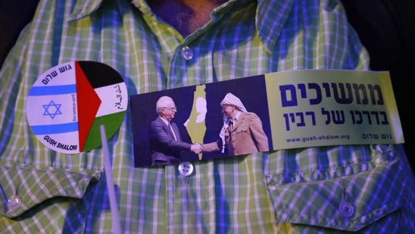 In this file photo taken on November 4, 2017, a demonstrator attends a rally to mark the 22nd anniversary of the assassination of former Israeli prime minister Yitzhak Rabin, at Rabin Square in Tel Aviv. JACK GUEZ / AFP