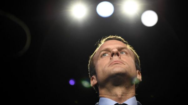In this file photograph taken on April 4, 2017, then French presidential election candidate for the En Marche ! movement Emmanuel Macron looks on prior to a debate organised by the French private TV channels BFM TV and CNews, between the eleven candidates for the French presidential election, on April 4, 2017 in La Plaine-Saint-Denis near Paris. Simultaneously battling the twin crises of the second wave of the coronavirus pandemic and a resurgence in Islamist attacks, French President Emmanuel Macron faces 