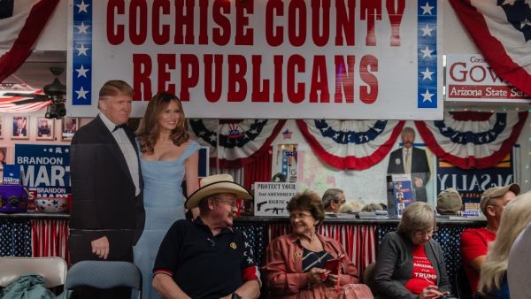 Supporters of US President Donald Trump watch the television to see the numbers coming in at the Cochise County Republican Headquarters in Sierra Vista, Arizona on November 3, 2020. ARIANA DREHSLER / AFP